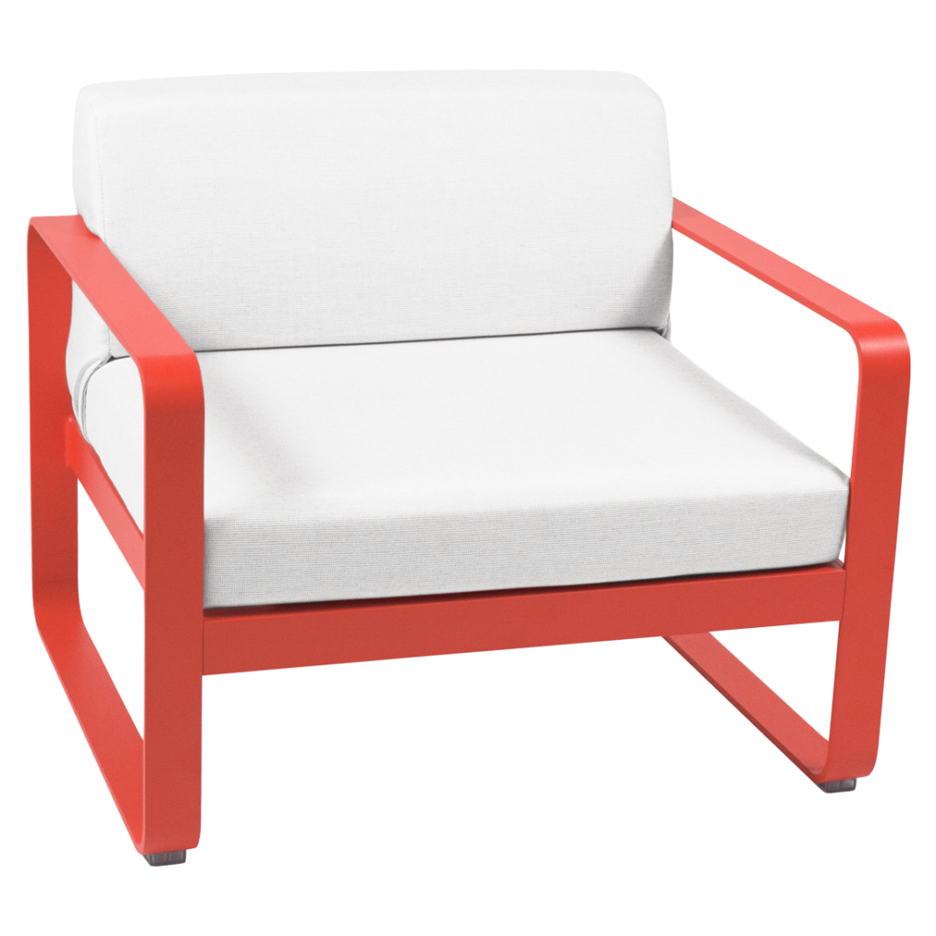 Une chaise longue rouge et blanche avec un coussin blanc.
