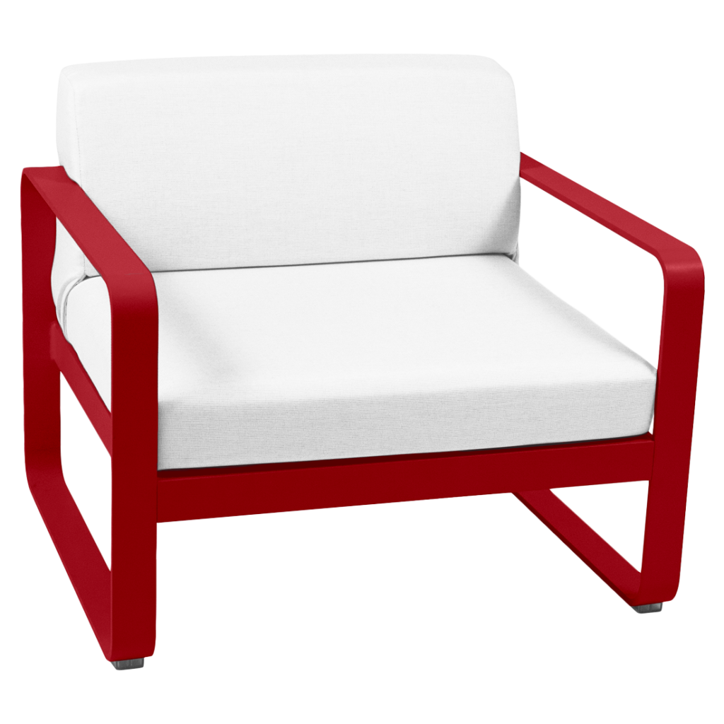 Une chaise longue rouge et blanche avec un coussin blanc.