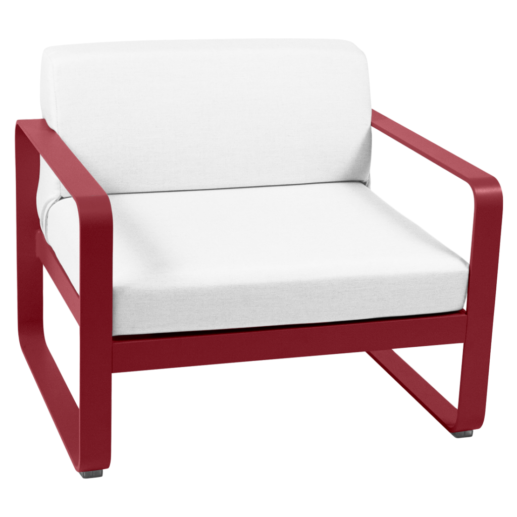 Une chaise longue rouge et blanche avec un coussin blanc.