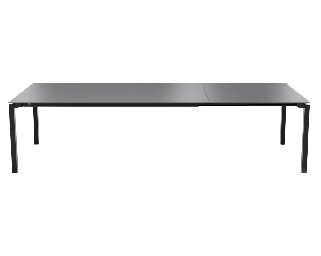 Une Table extensible Terra avec une structure en métal couleur Terra et un plateau noir.