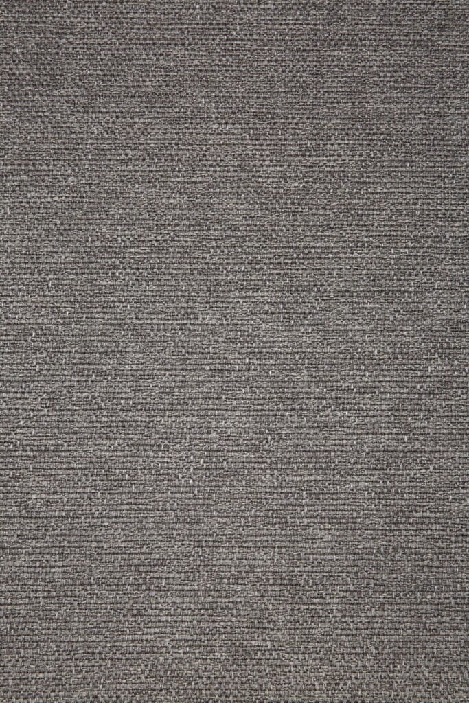 Image en gros plan d'un tapis gris présentant un Canapé Jack 3 places, motif teck noir.