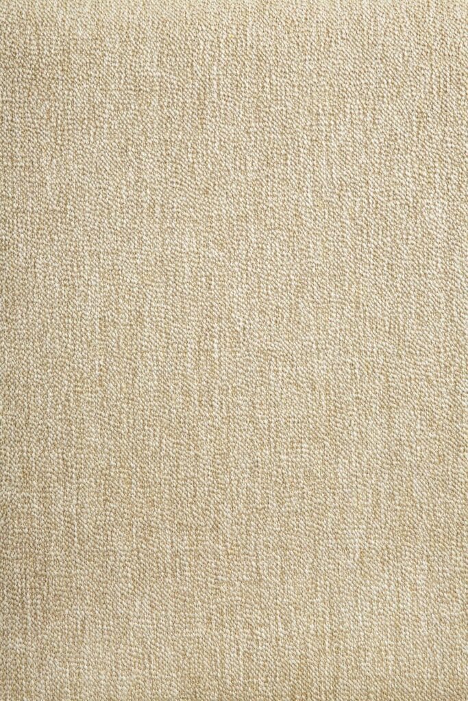 Un gros plan d'un tissu teck beige.