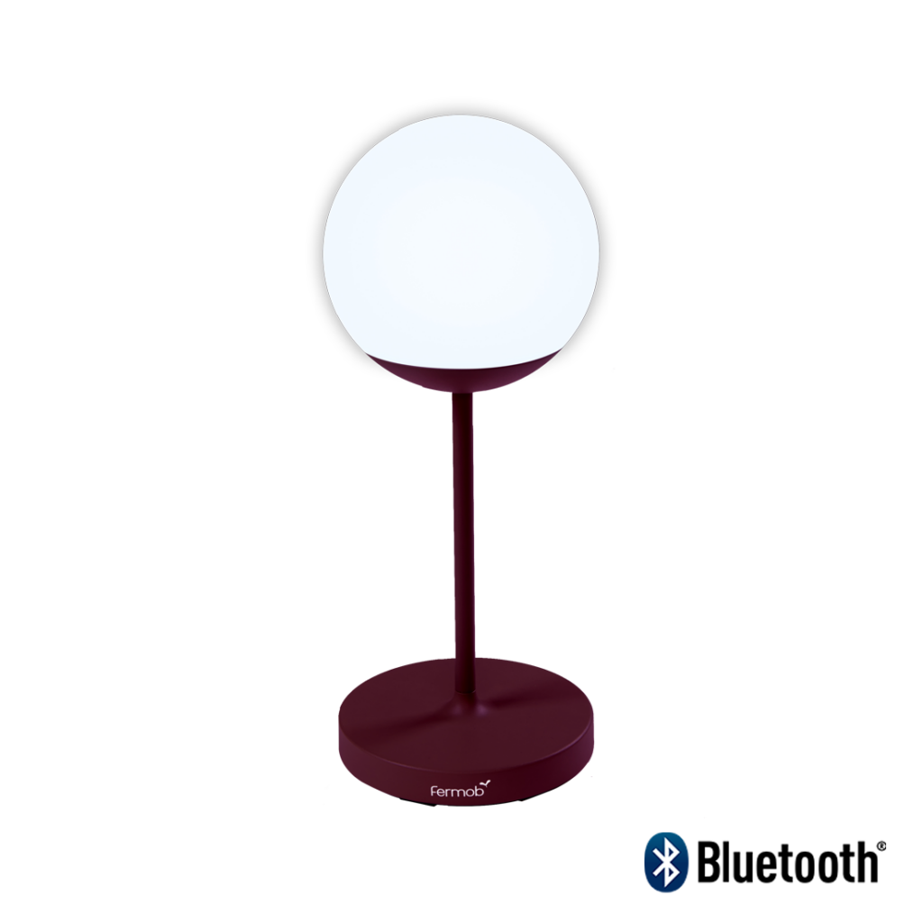 Une lampe de table cerise noire avec un Mooon bleu ! lumière dessus.