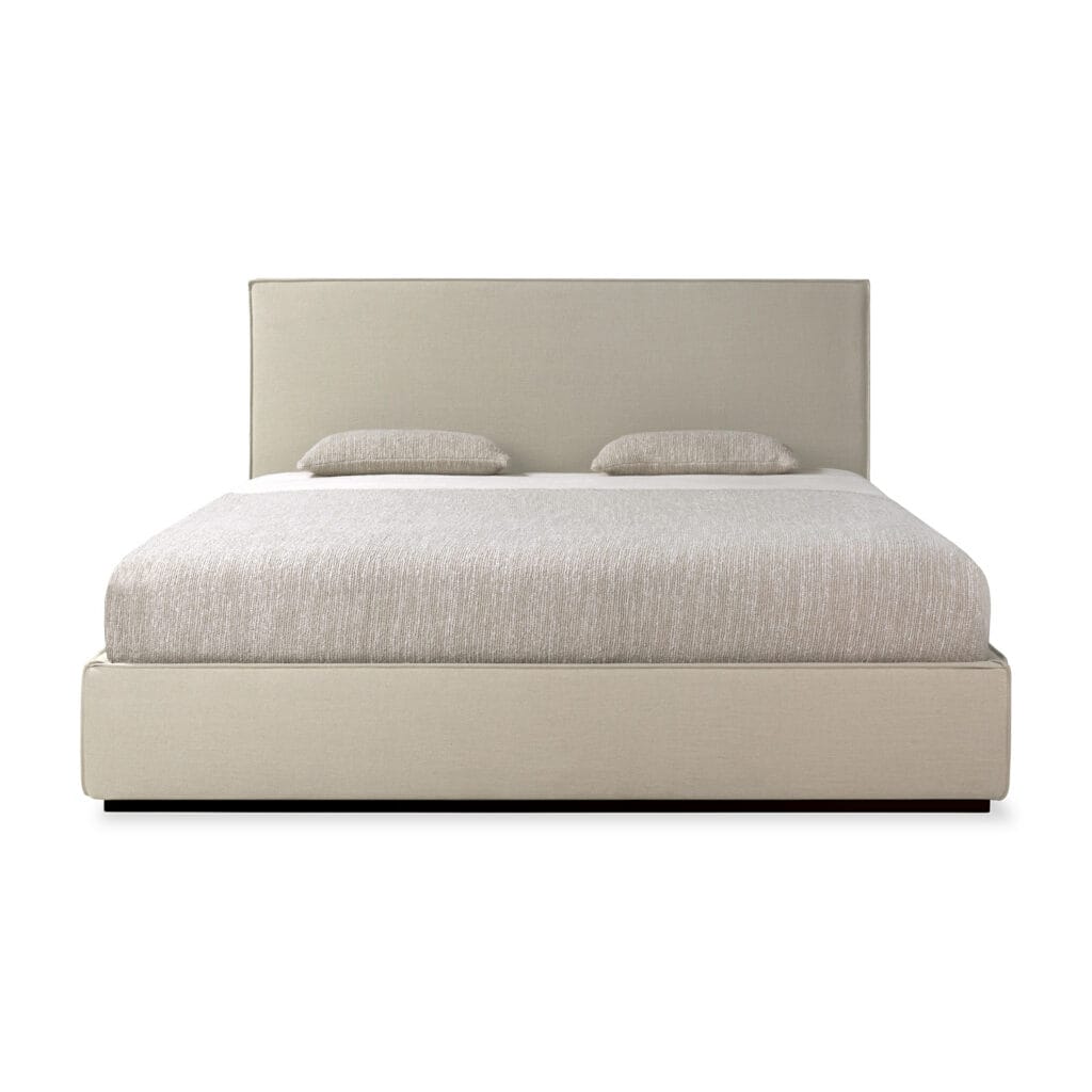 Un lit avec une tête et un pied de lit rembourrés beige, parfait pour les mots-clés Lit Revive SEO.