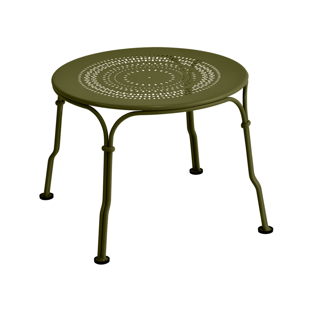 Une Table basse verte avec pieds en métal pour les amateurs de Guimauve des années 1900.