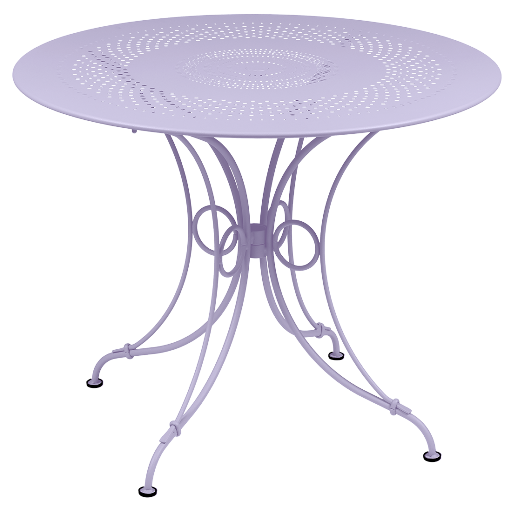 Une table Guimauve de 96 cm de diamètre, présentant un motif fleuri sur fond blanc.