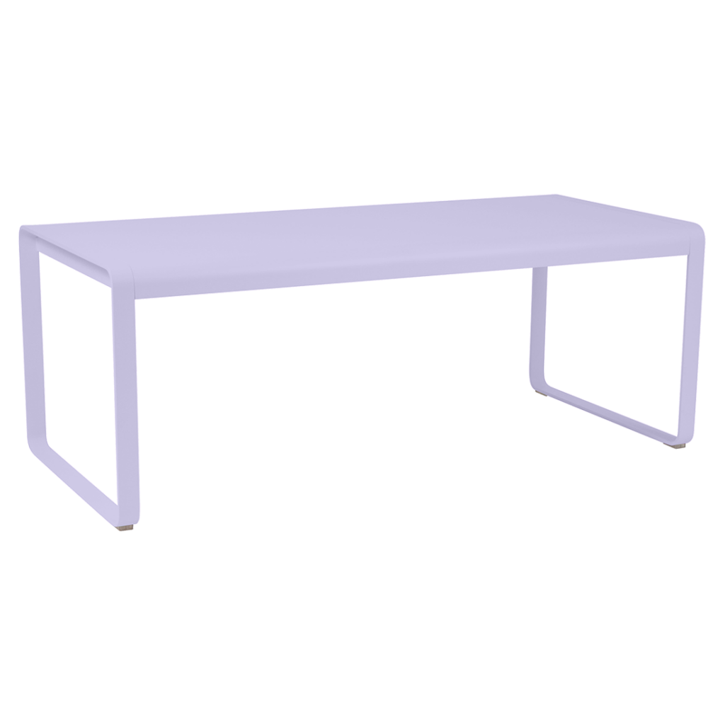 Une table Guimauve violette avec un piètement blanc.