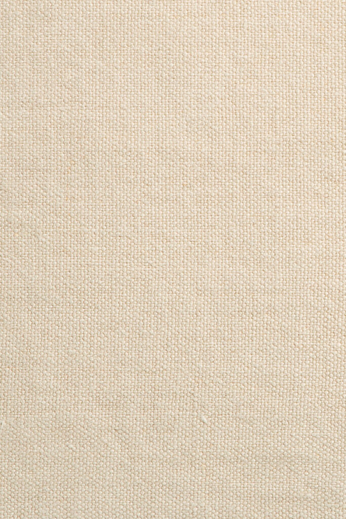 Gros plan du coussin Lin avec un tissu beige texturé avec un motif tissé.
