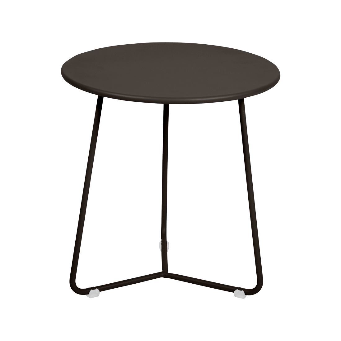 Une petite table d'appoint ronde noire aux pieds fins en métal se détache sur un fond violet clair, ajoutant une touche moderne rappelant le style Cocotte.