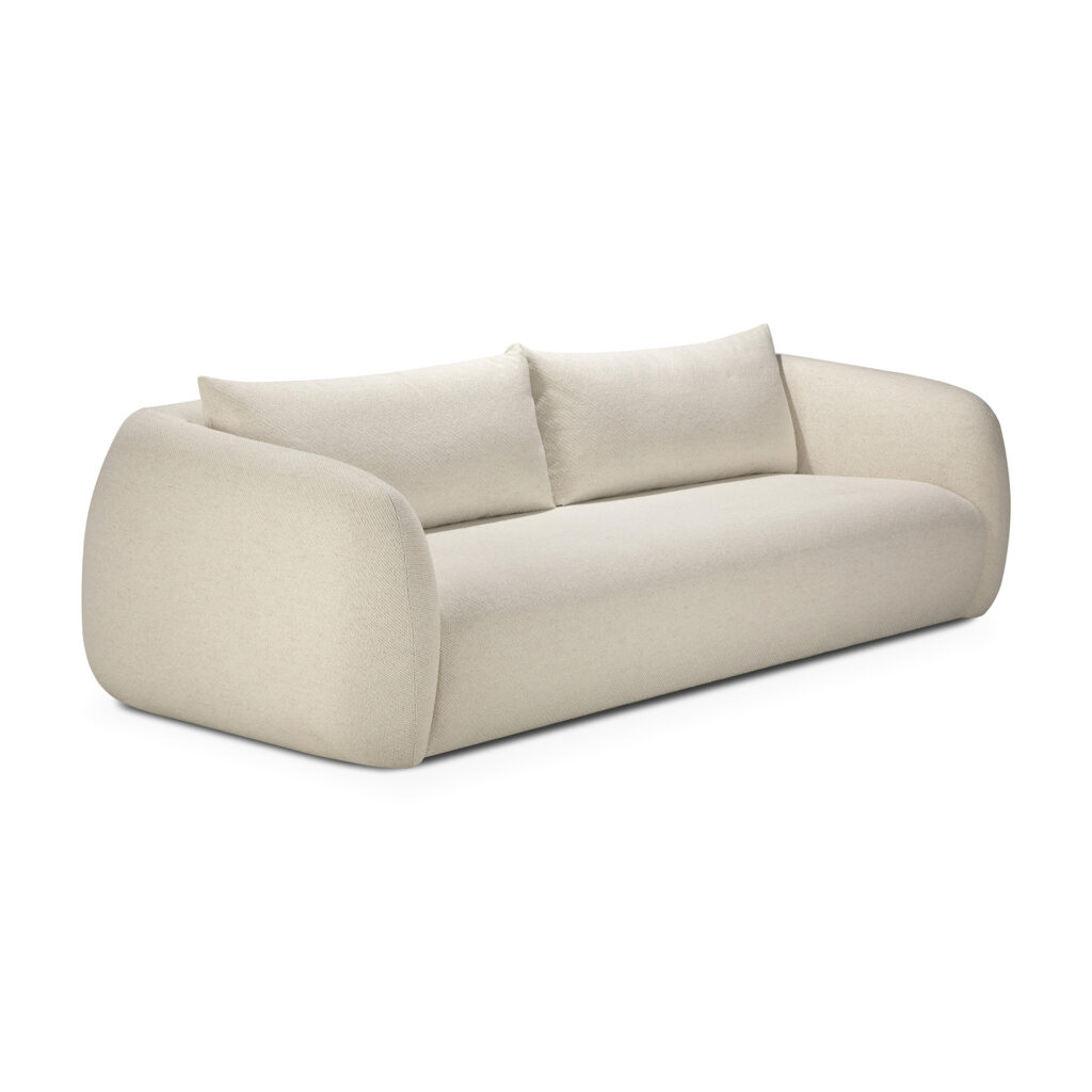 Un canapé moderne Contour 3pl, de couleur crème avec des accoudoirs arrondis et deux coussins de dossier assortis, est présenté sur un fond blanc.