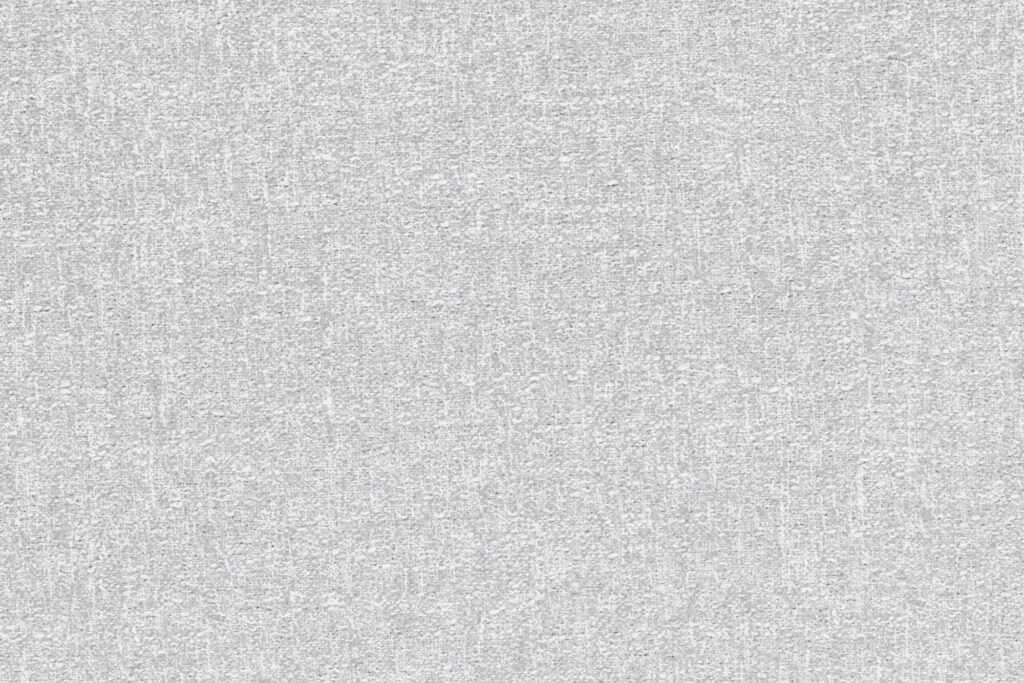 Vue rapprochée d'une surface texturée mélangée gris clair ressemblant à un tissu ou à un papier peint, avec un motif tissé subtil, semblable au bouclé souvent utilisé sur un siège moderne.