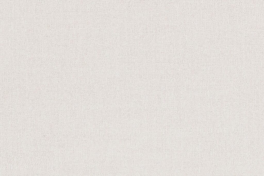 Le tissu Bouclé recyclé beige clair avec un motif tissé subtil remplit tout le cadre - idéal pour le Sumo Hocker.